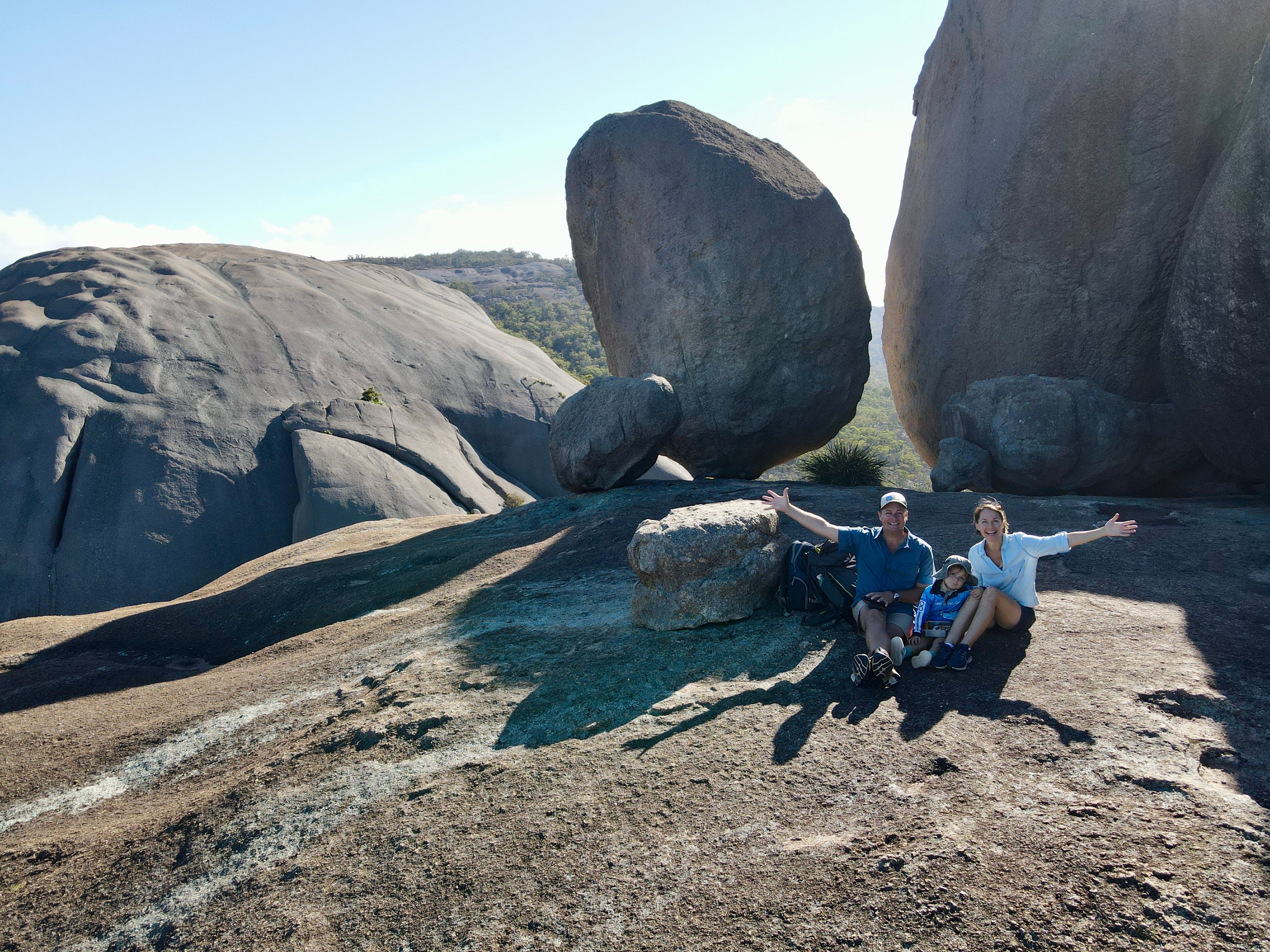 A family posing amongst boulders in Girraween National Park, QLD