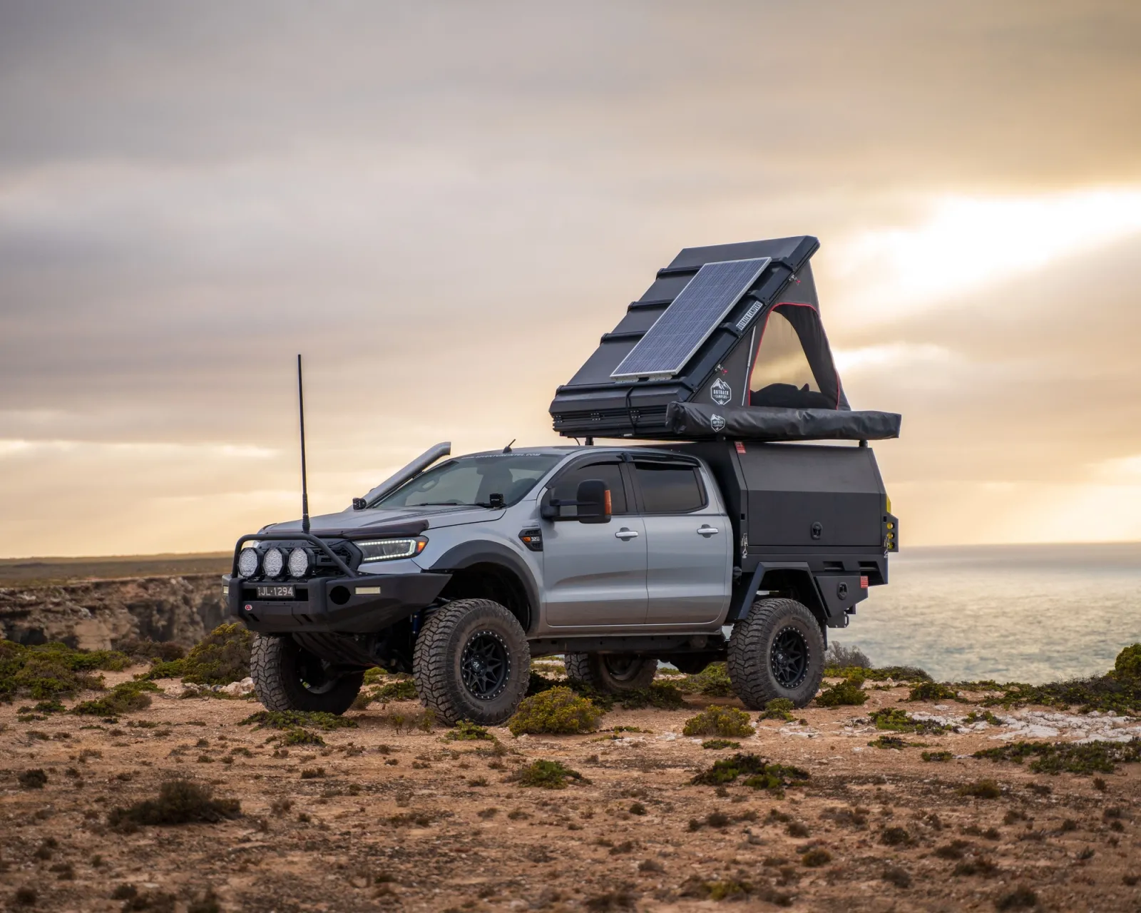 modified 4x4 with roof top tent camping in outback