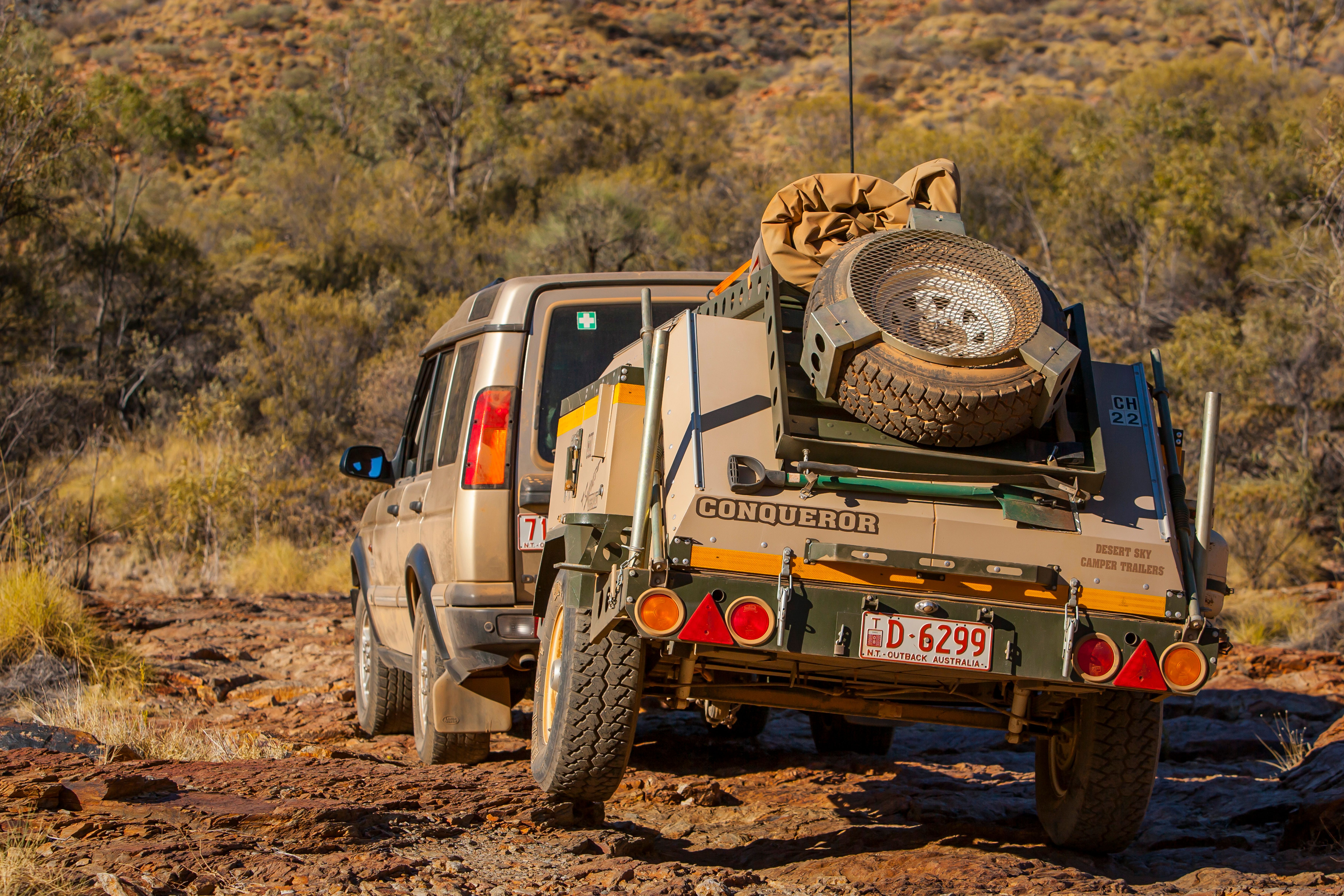 A camper trailer being towed in outback australia