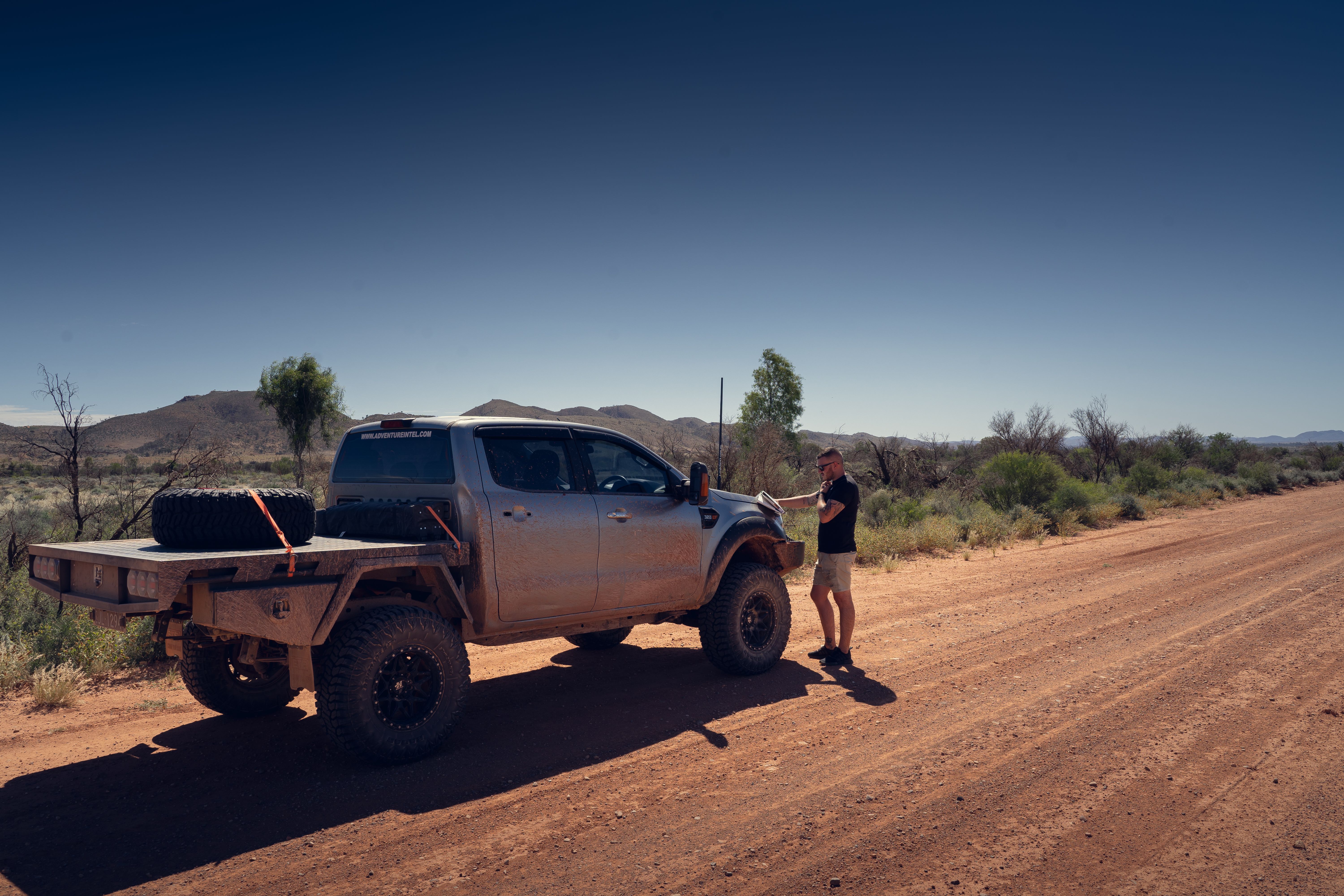 A man and a 4WD in Australia's outback