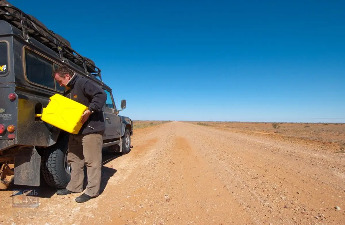 refilling 4wd with diesel on remote outback road