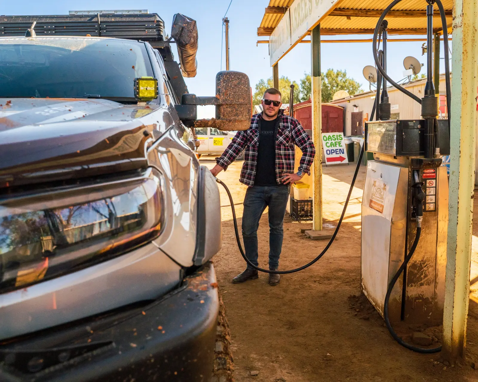 Josh from Adventure Intel Australia filling up his Ford Ranger at a service station in the Outback