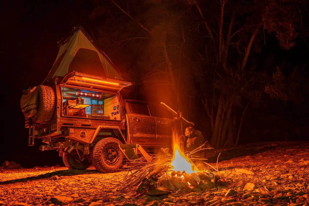 campfire with roof top tent outback