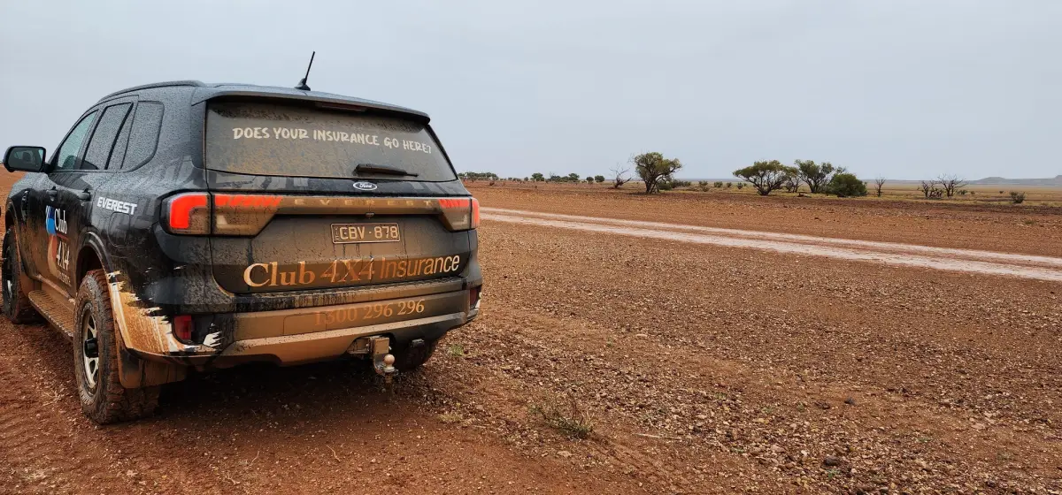 Club 4X4 branded Ford Everest covered in mud in outback red dirt