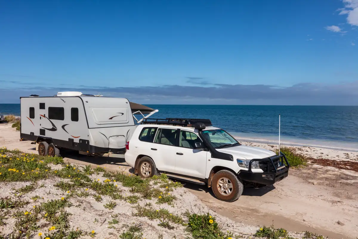 4x4 and caravan pictured camped at a beach