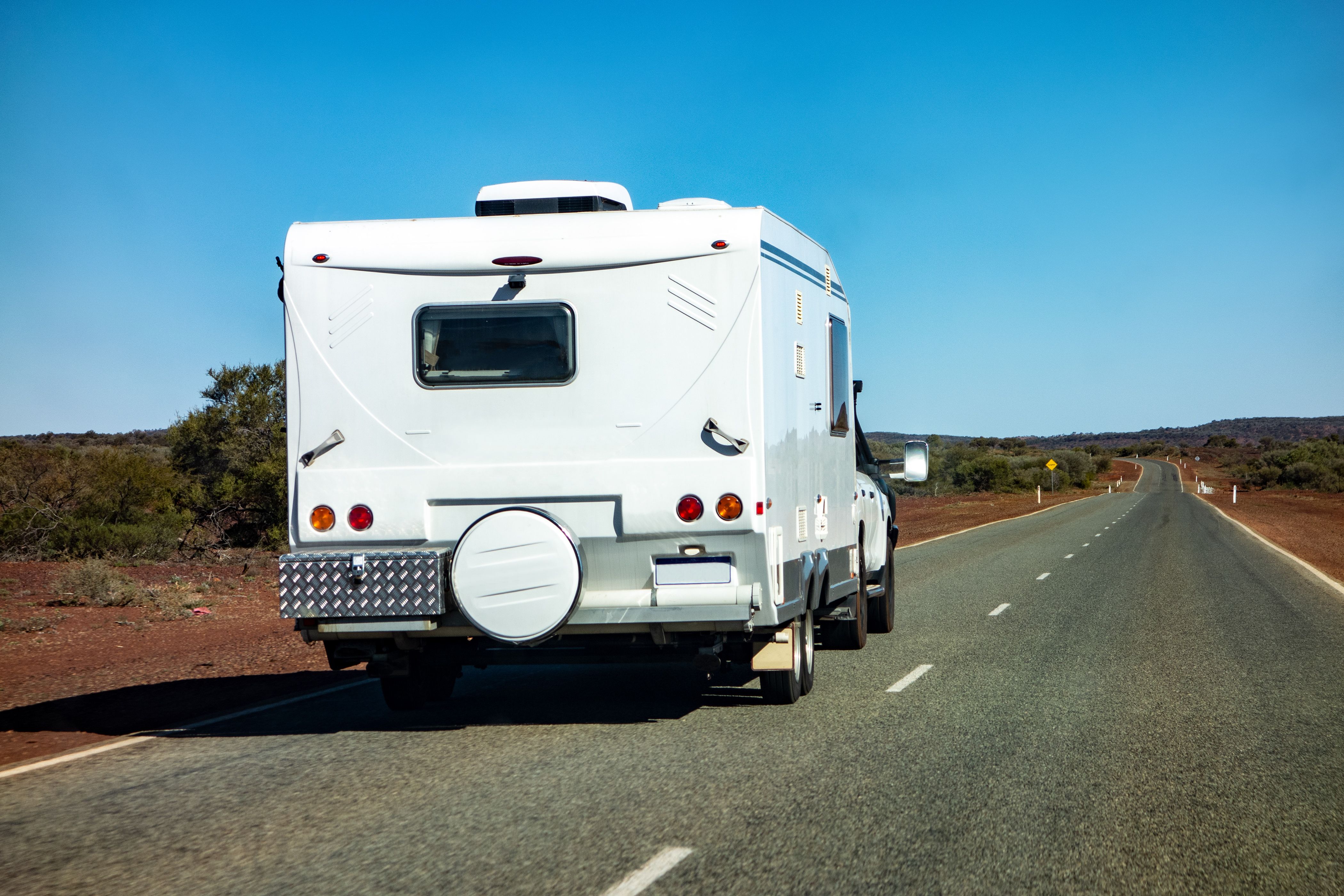 A caravan being towed on a highway