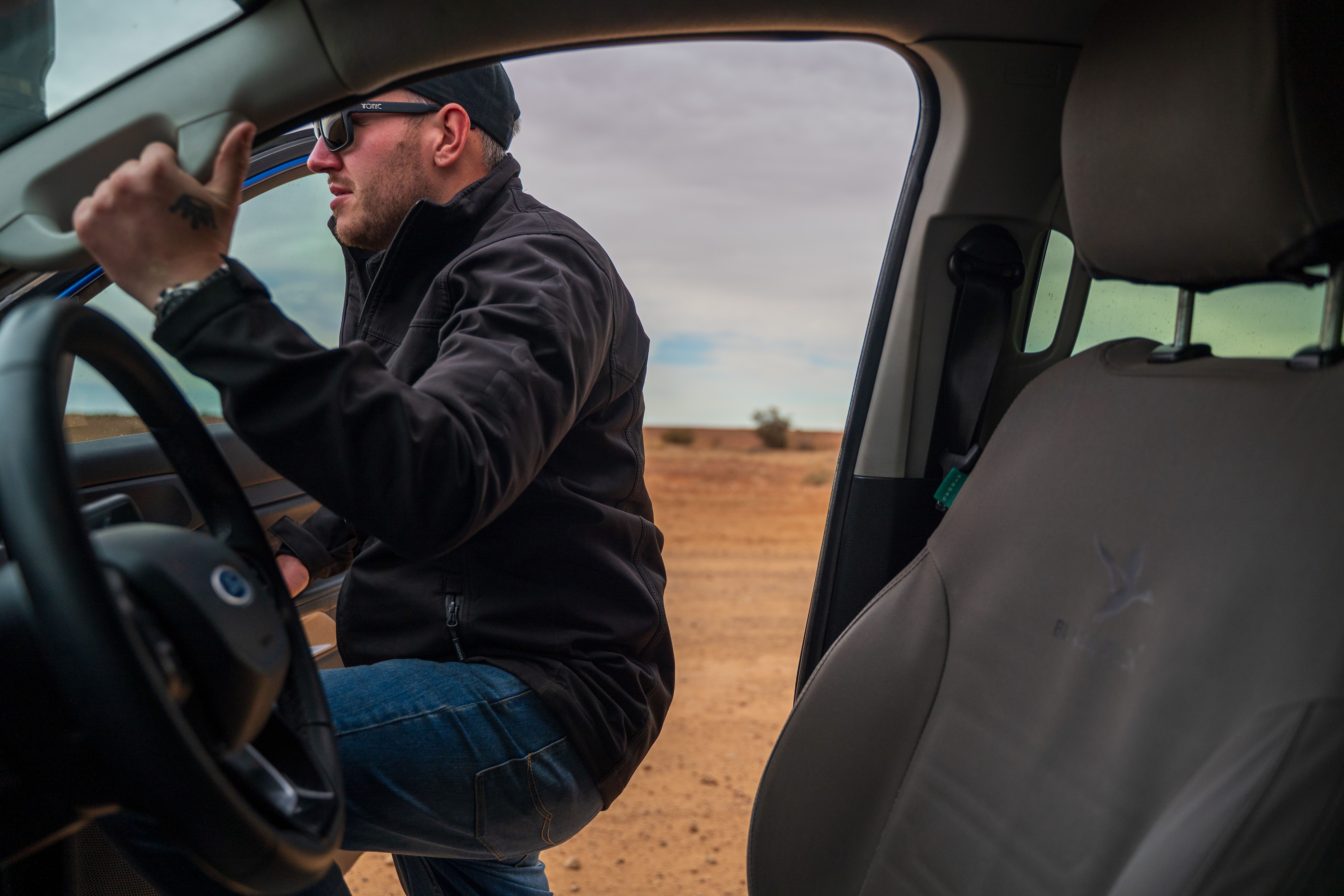 A man getting into a Ford Ranger 4X4