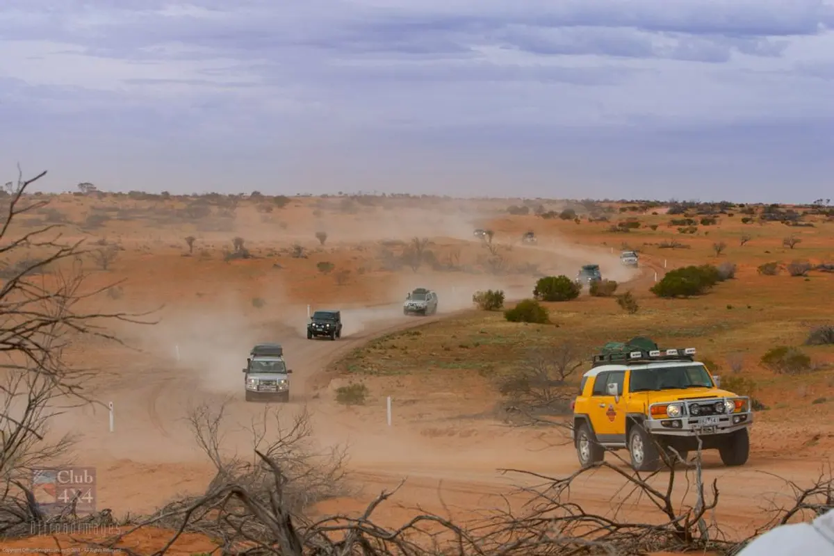 4wd convoy on dusty outback road