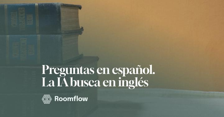 Libros antiguos apilados, entre ellos diccionarios de inglés y español, frente a una pared naranja.