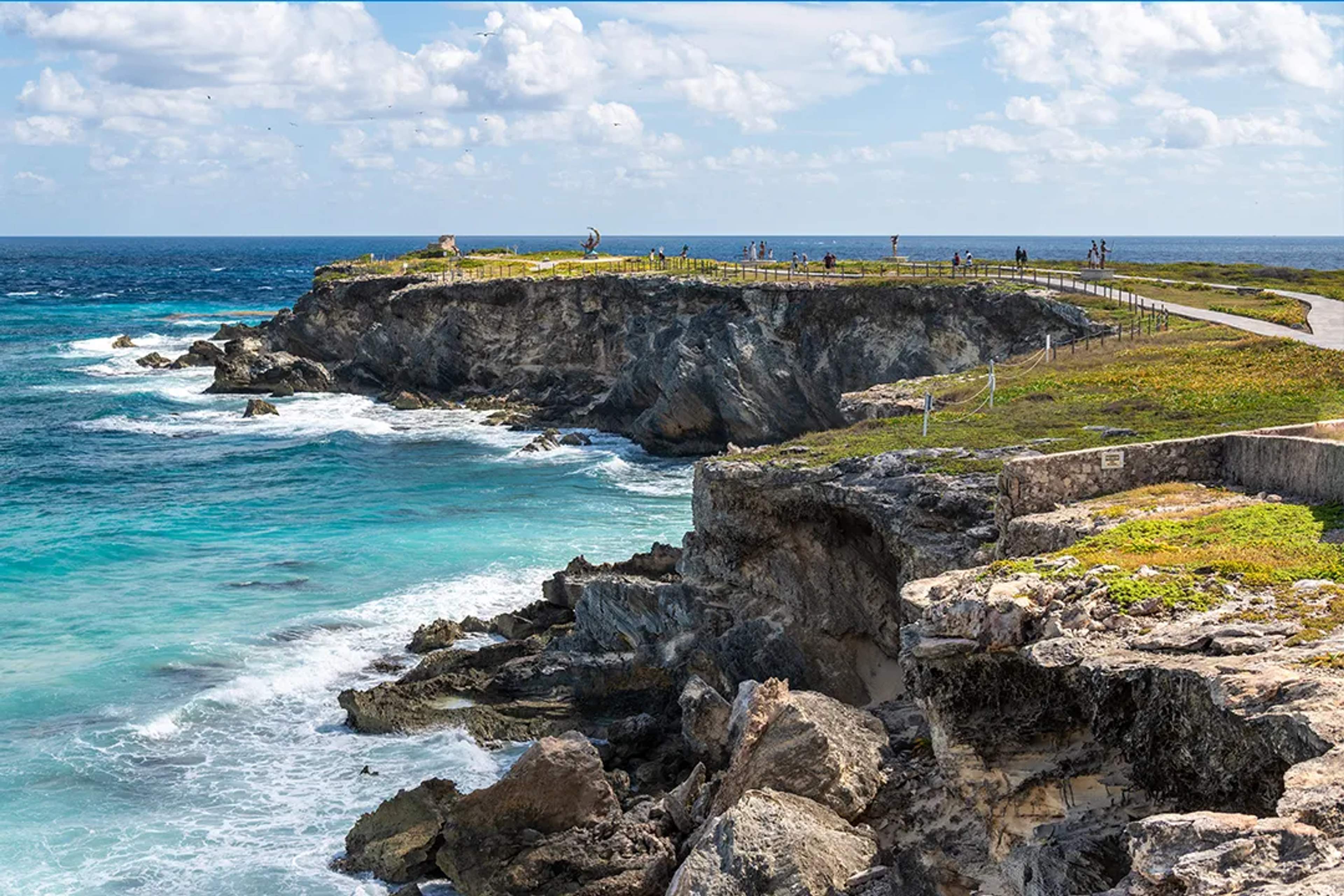 Oceanfront cliffs and turquoise Caribbean views at Punta Sur during an Isla Mujeres adventure tour