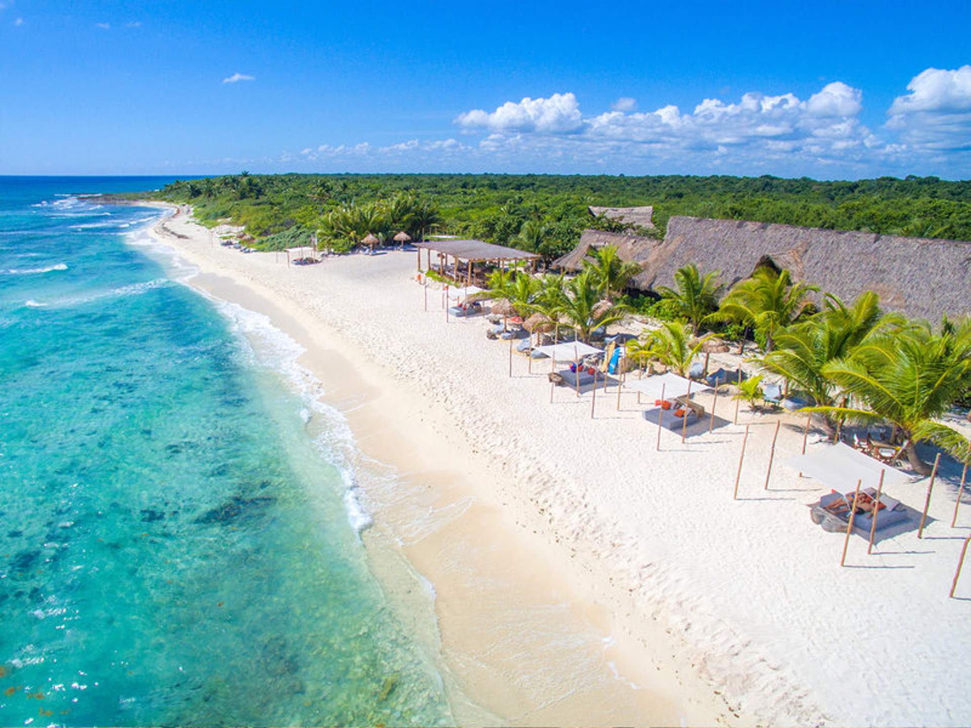 Aerial view of Punta Venado beach club in Playa del Carmen, with turquoise waters.