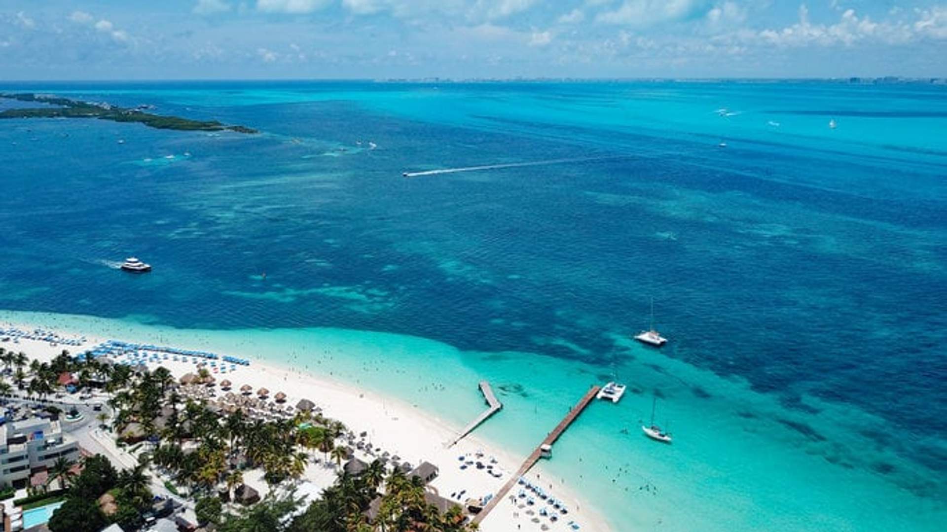 Pristine beaches of Isla Mujeres with turquoise waters and stunning natural beauty, perfect for relaxation and adventure.