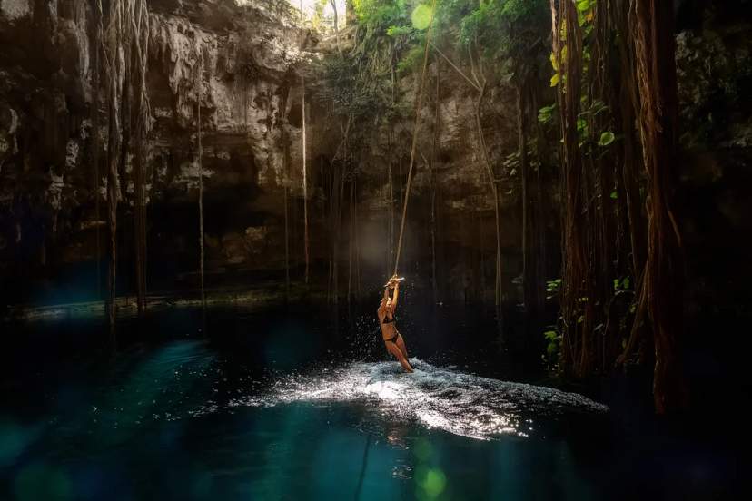 Swing into the magic of a jungle cenote, sunlight, vines, and a refreshing splash await you!