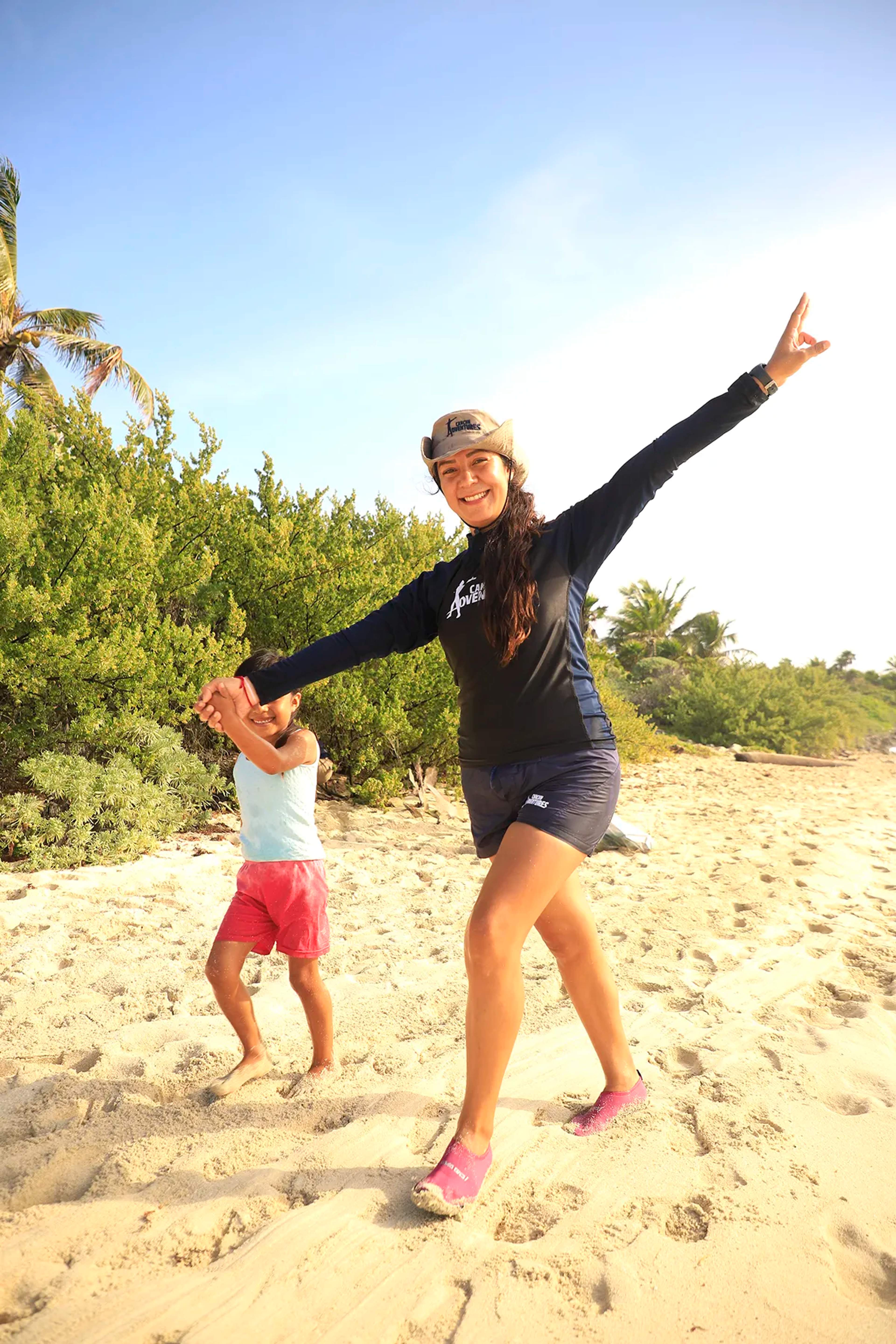Cancun Adventures employee participating in a beach cleanup.