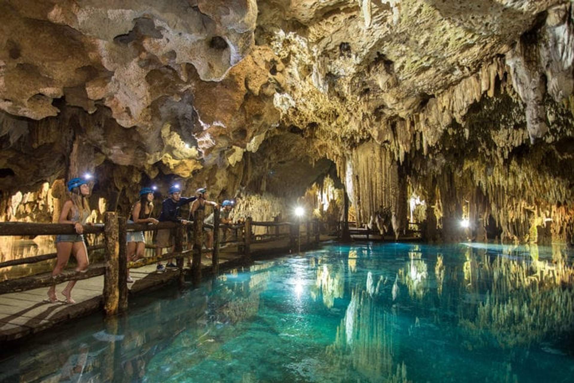 Tour group exploring a cenote cave, perfect for kid-friendly adventures in Cancun.