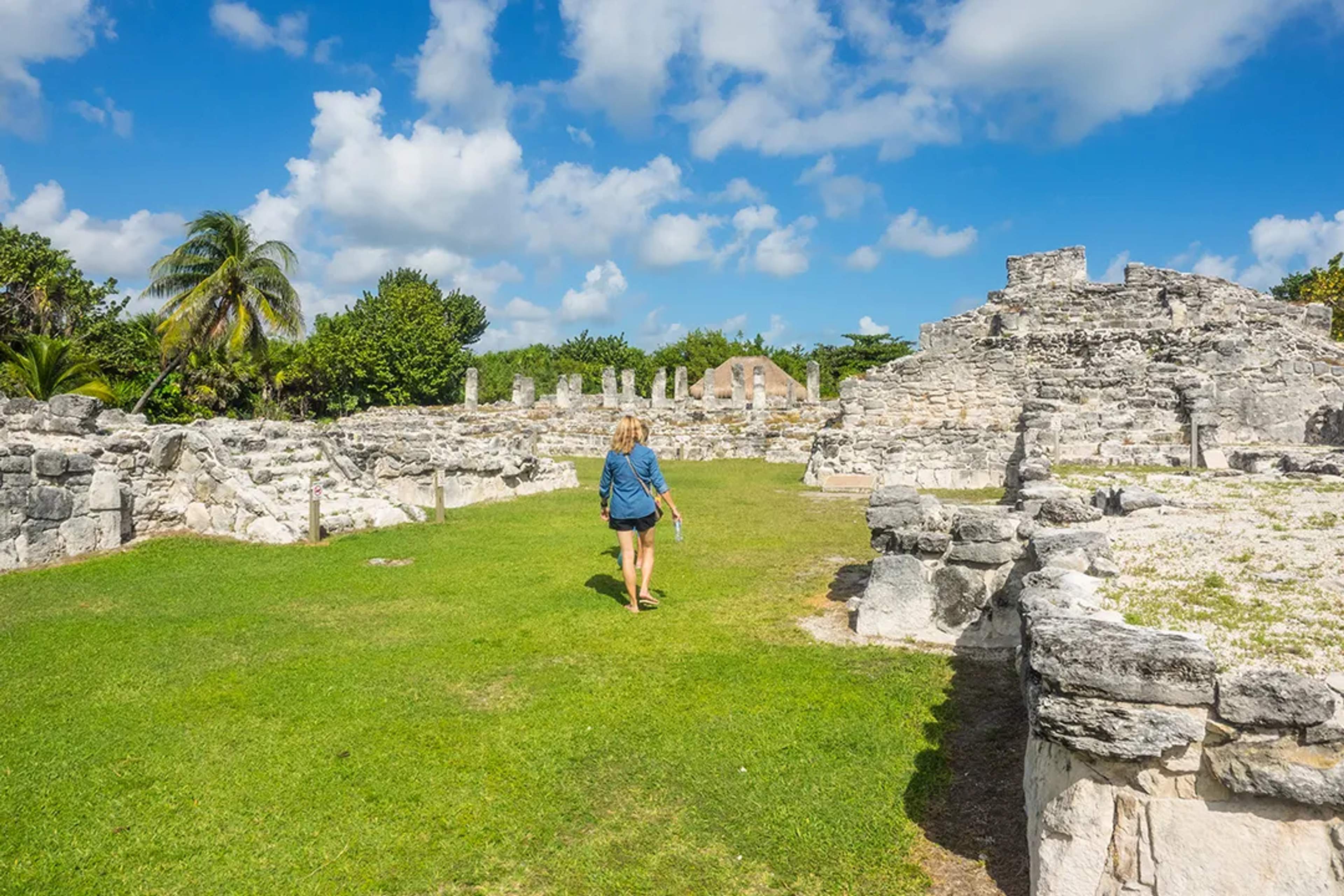 Walk through El Rey archaeological site in Cancun and discover ancient Maya ruins and local wildlife