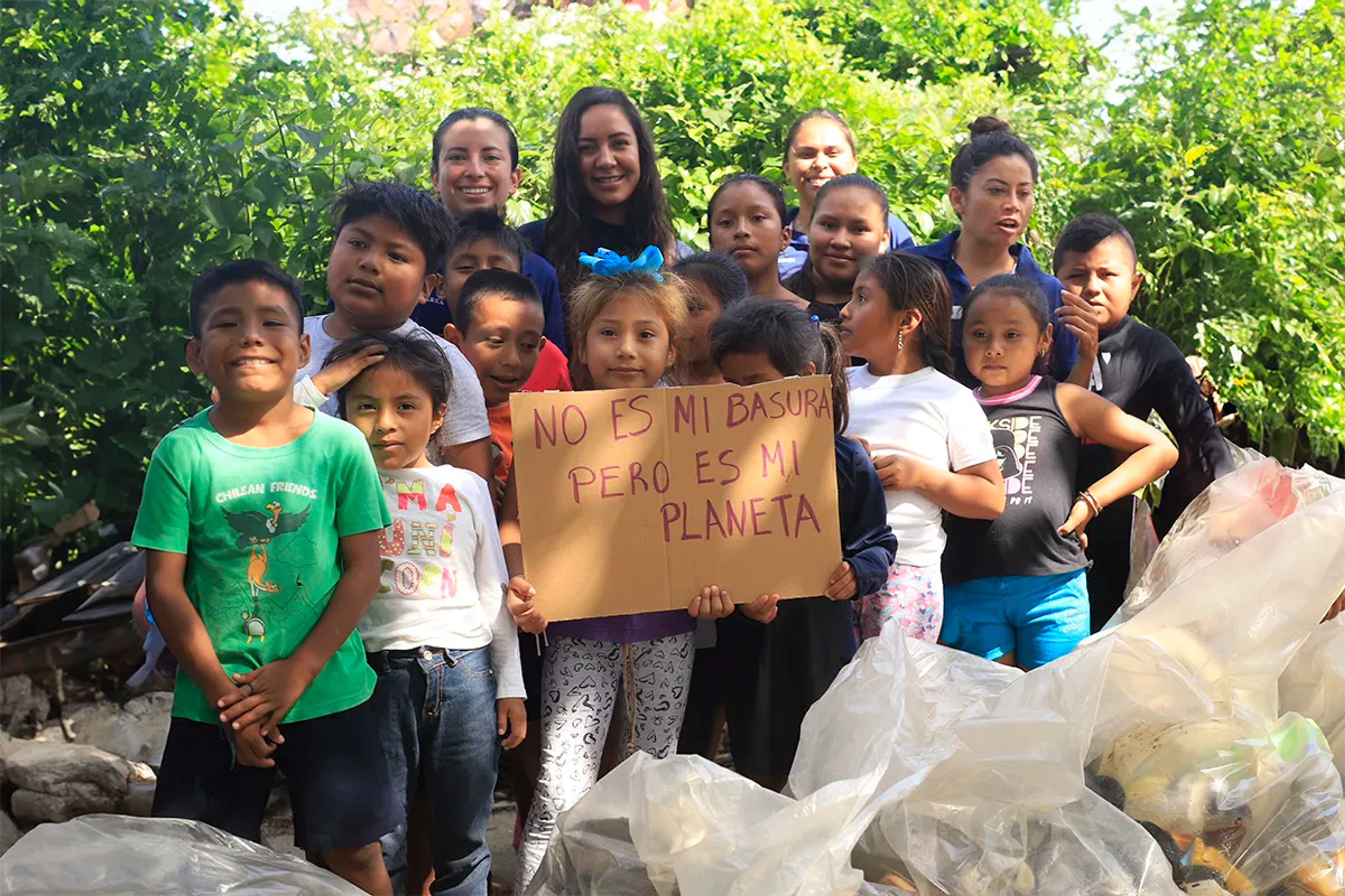 Volunteer children on a beach cleanup.