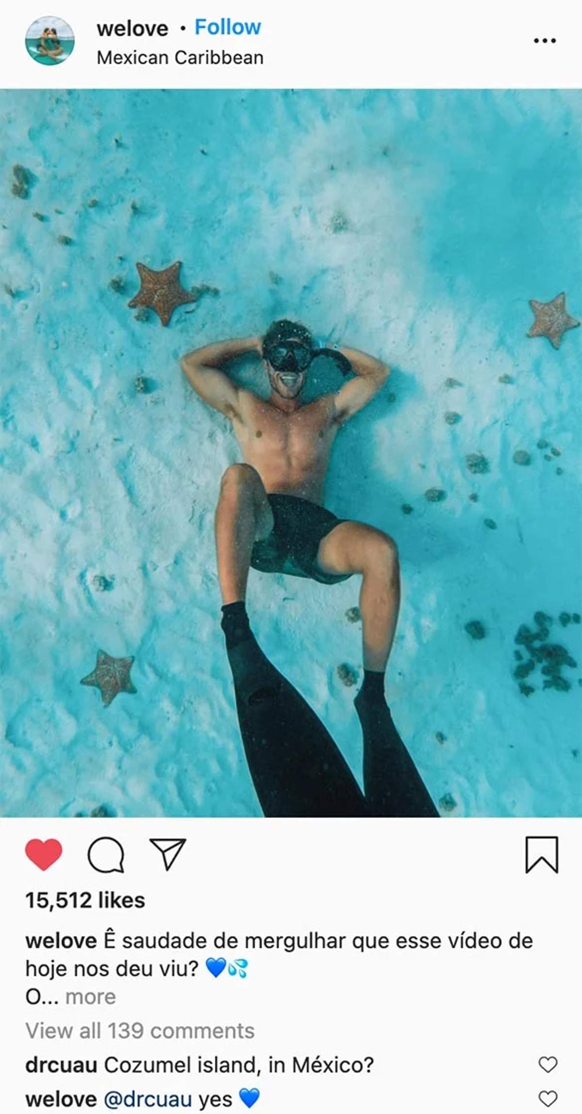 A snorkeler relaxing underwater in Cozumel's clear blue waters, surrounded by starfish, with another diver's fins in the foreground.