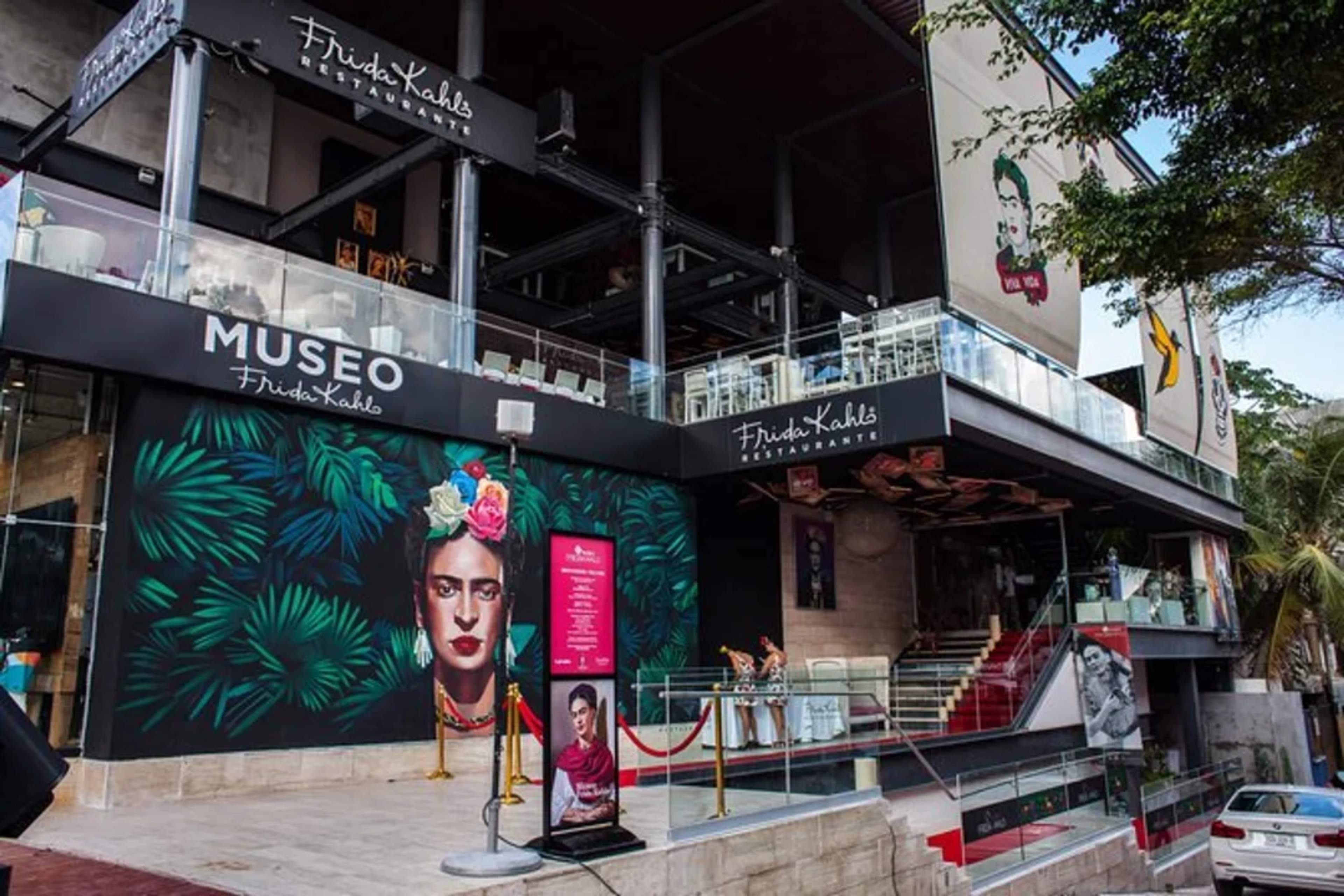 Frida Kahlo Museum and restaurant in Playa del Carmen with vibrant mural and modern design.