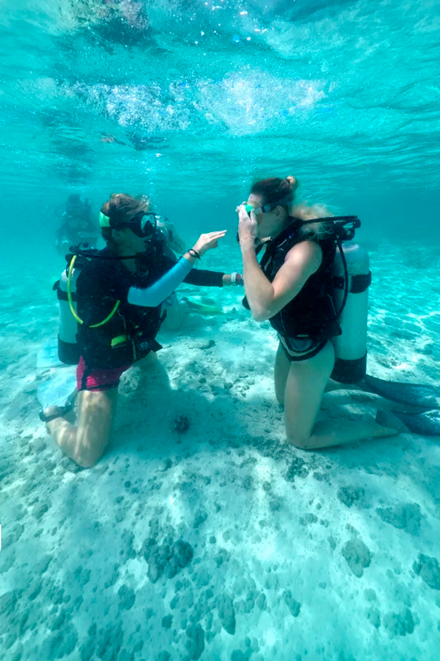 Young woman during scuba certification in Cancun as part of a PADI Referral program.