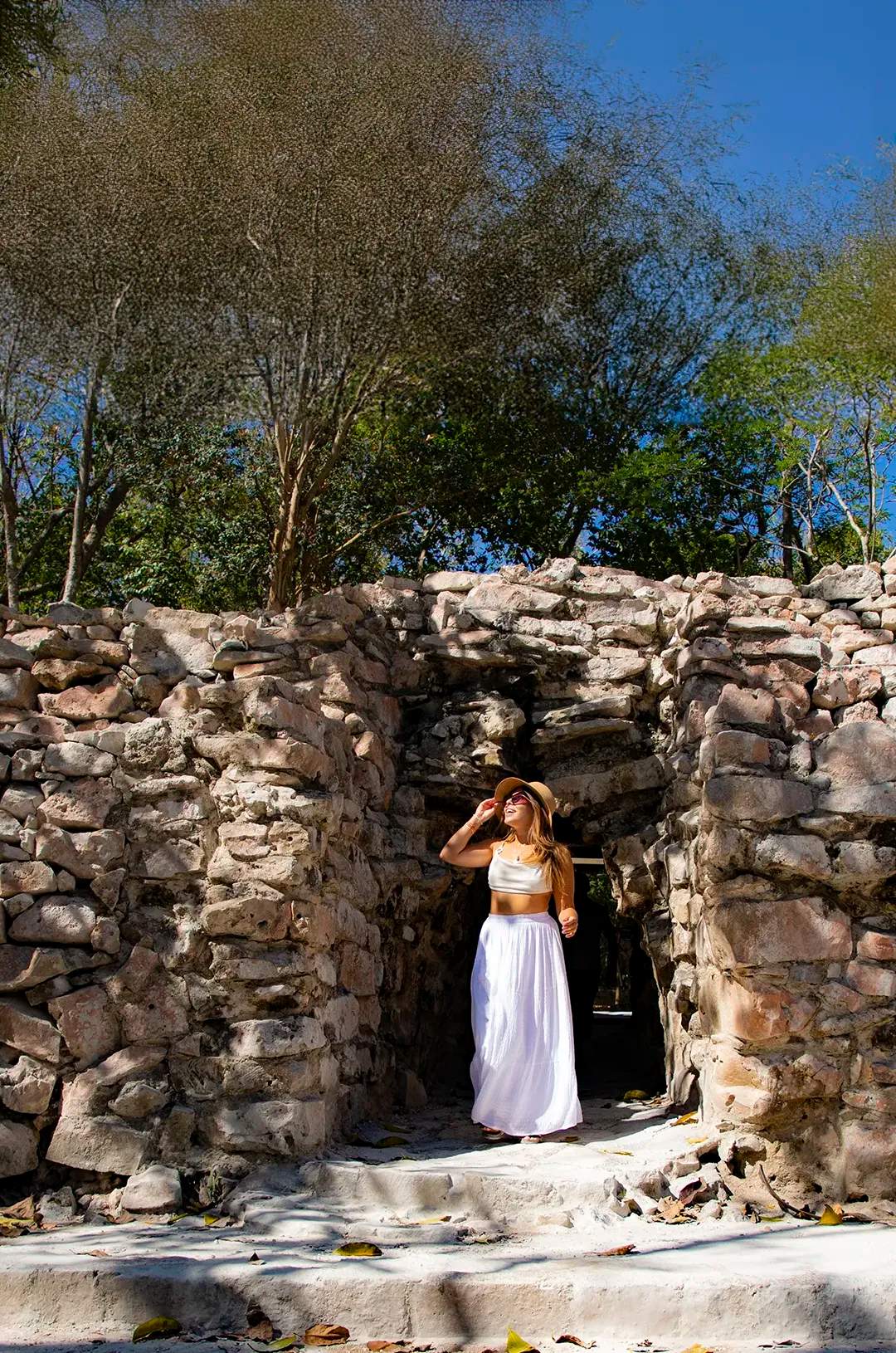 Traveler exploring the Tulum ruins in a Cancun tour package.