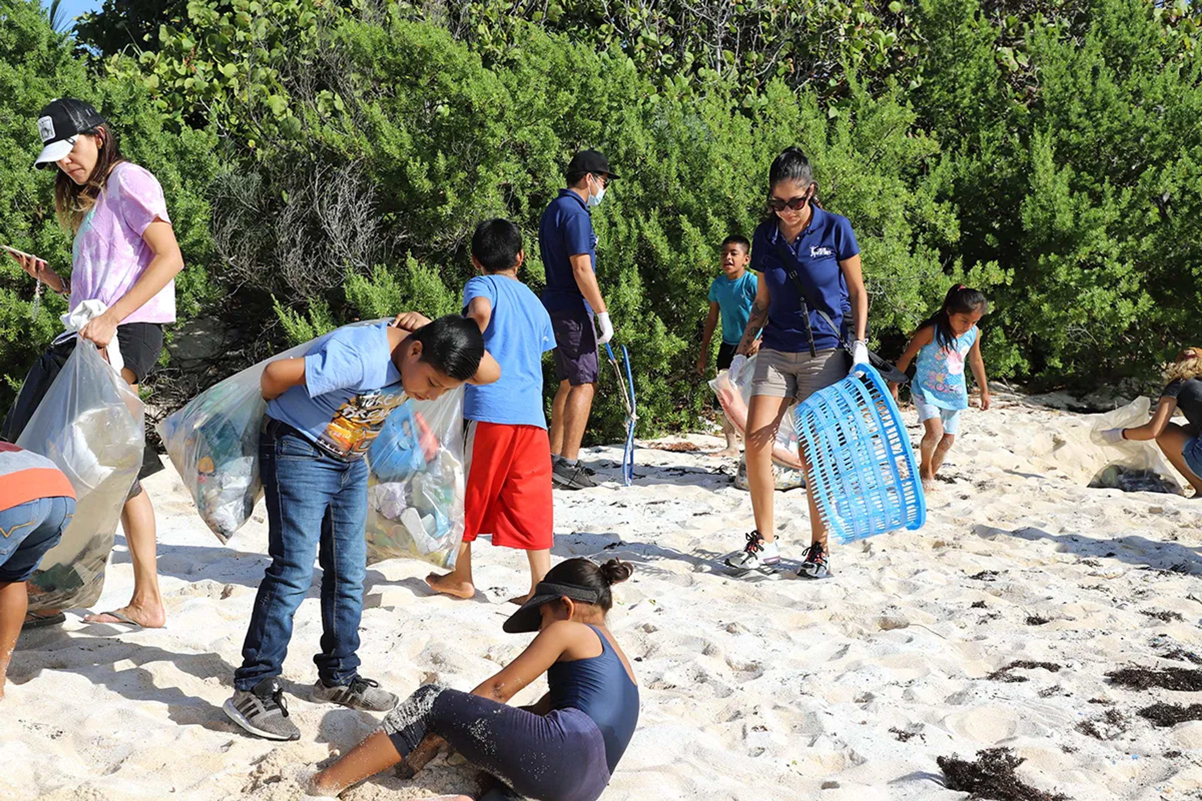 Cancun Adventures and volunteers cleaning up a beach in Riviera Maya.