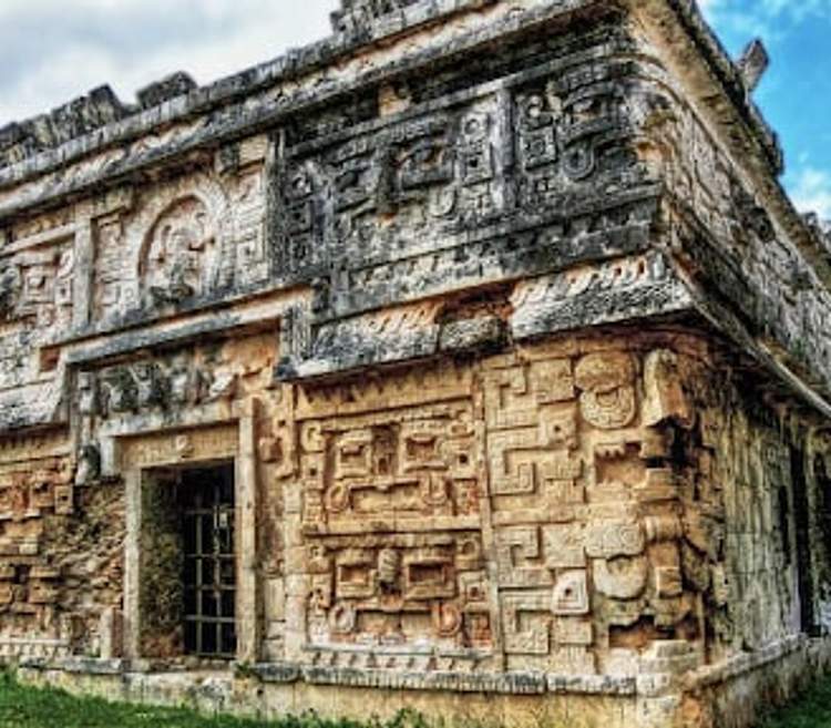 Eastern chamber of Las Monjas at Chichen Itza, featuring intricate hieroglyphic inscriptions and luxurious architectural details.