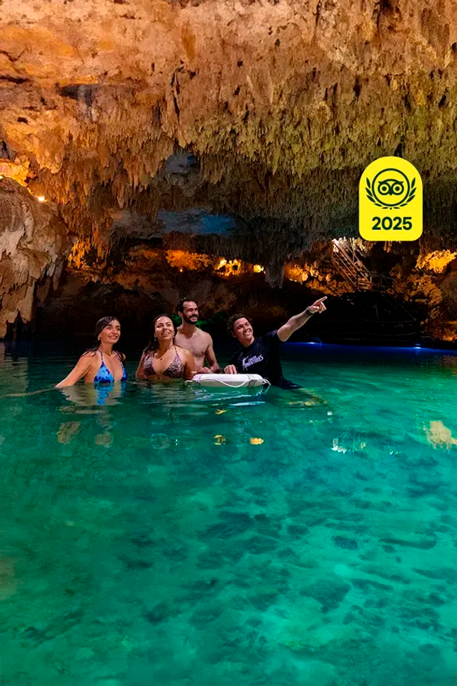 Group of friends exploring a beautiful cenote cave