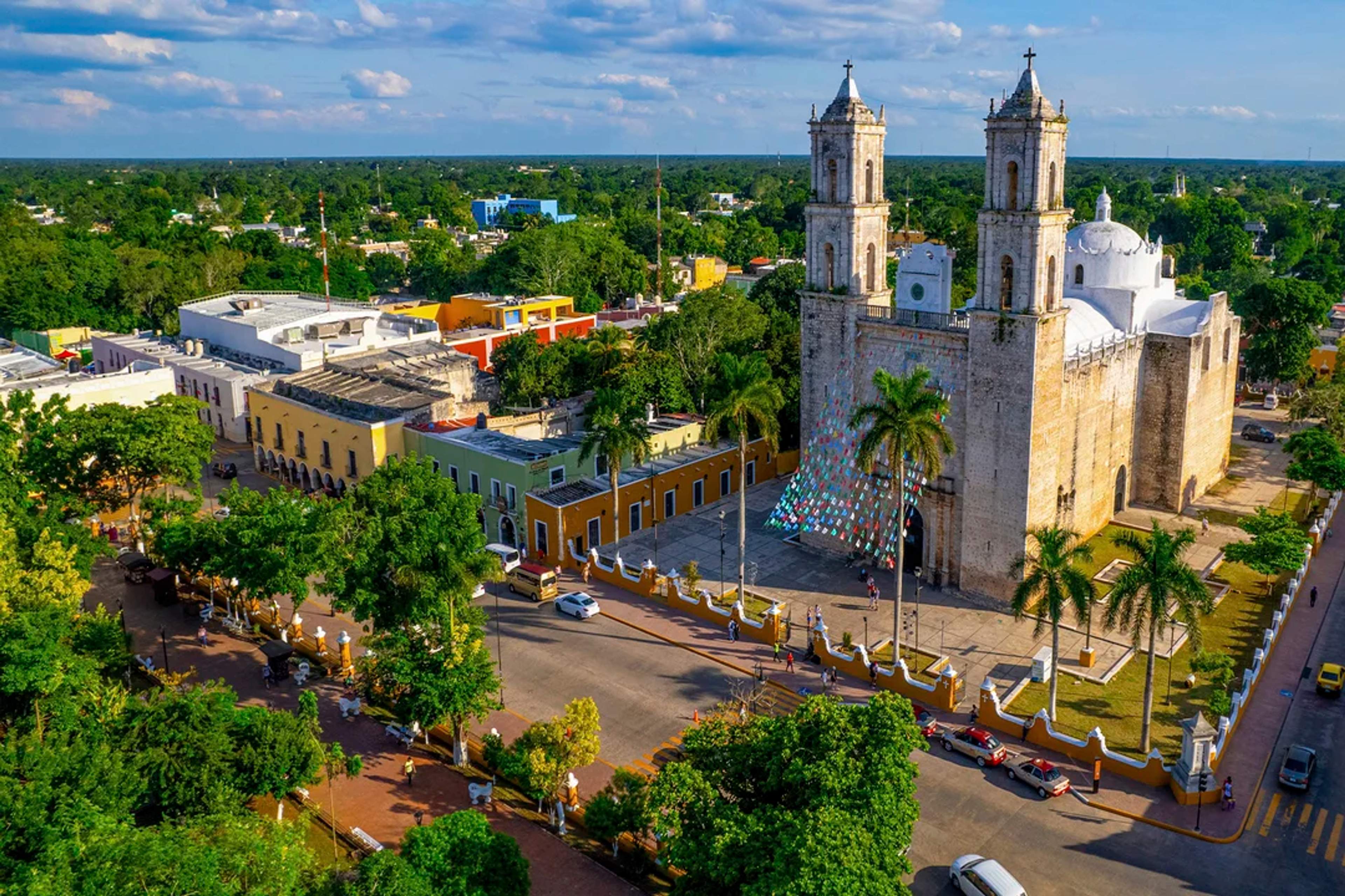 Aerial view of Valladolid’s main square with the iconic San Servacio Church and colorful colonial buildings.