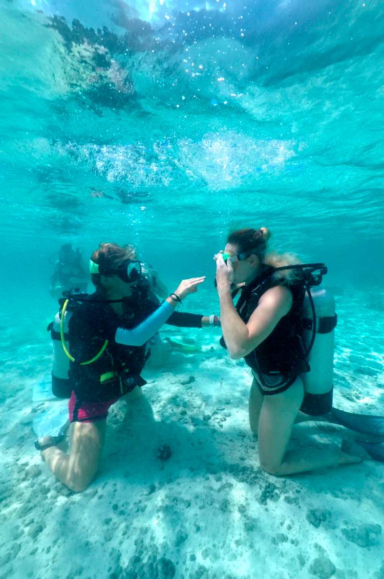 Young woman during scuba certification in Cancun as part of a PADI Referral program.