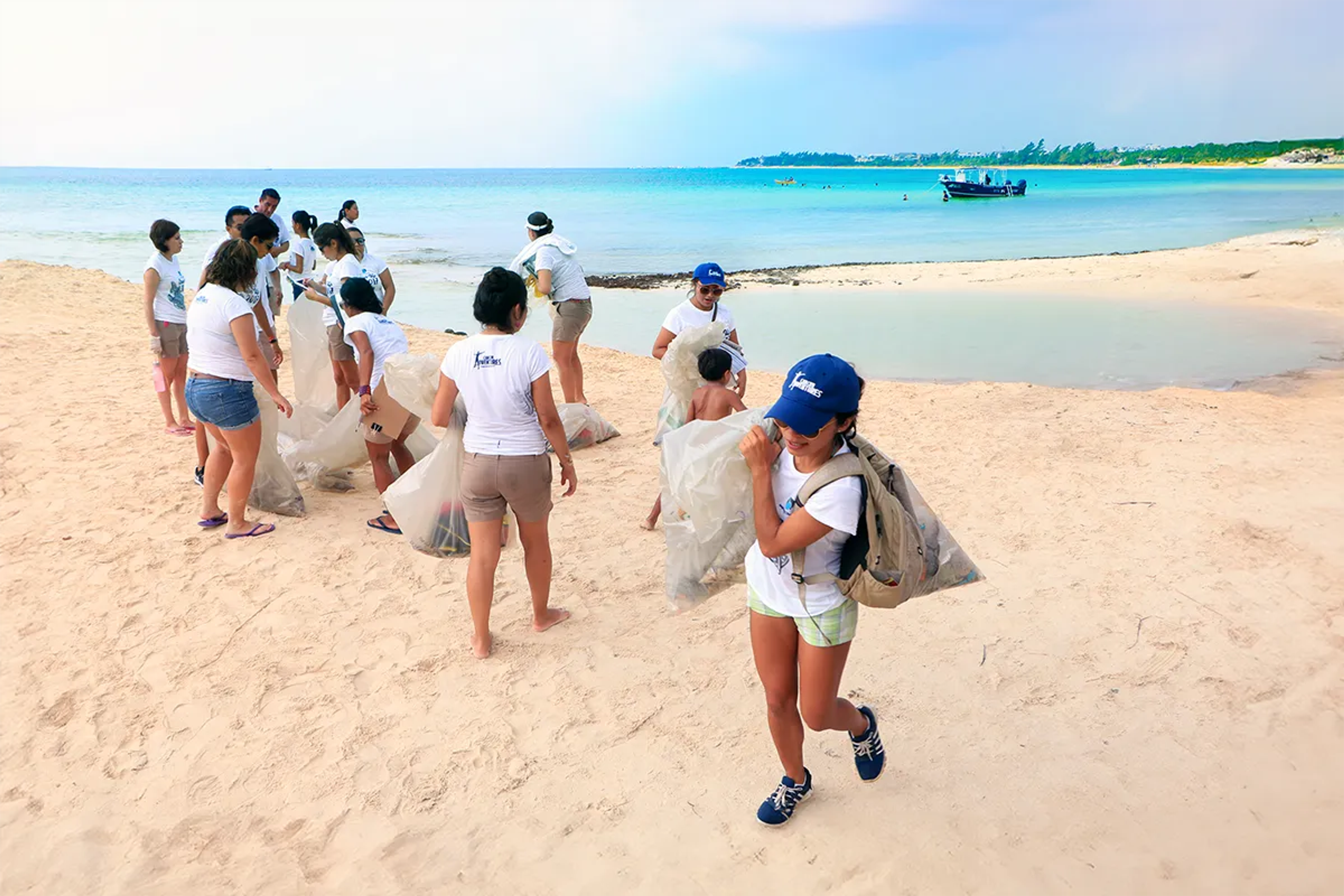 Cancun Adventures employees on a beach cleanup.