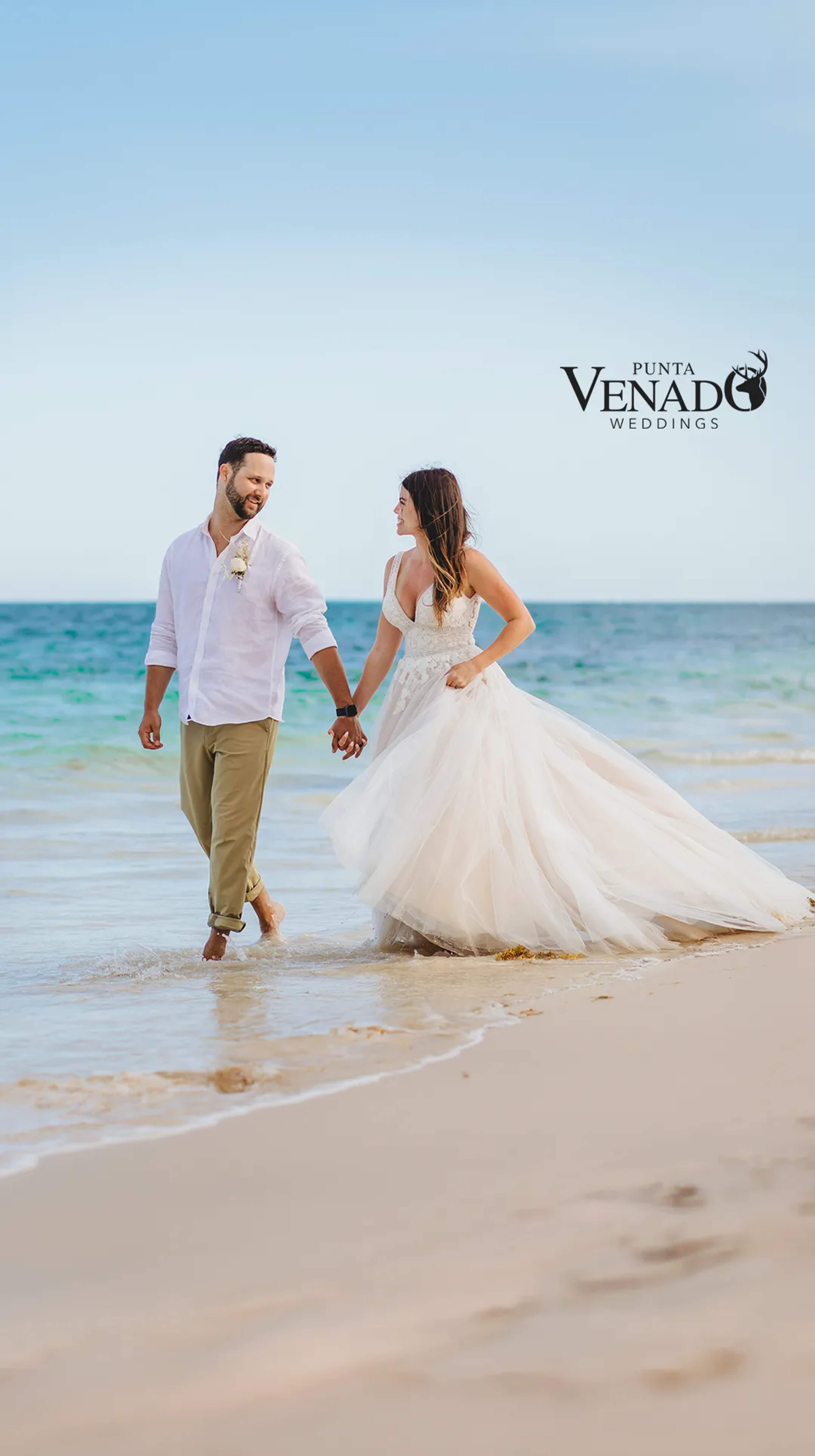 Happy couple at the most beautiful Cancun beach wedding destination venue.