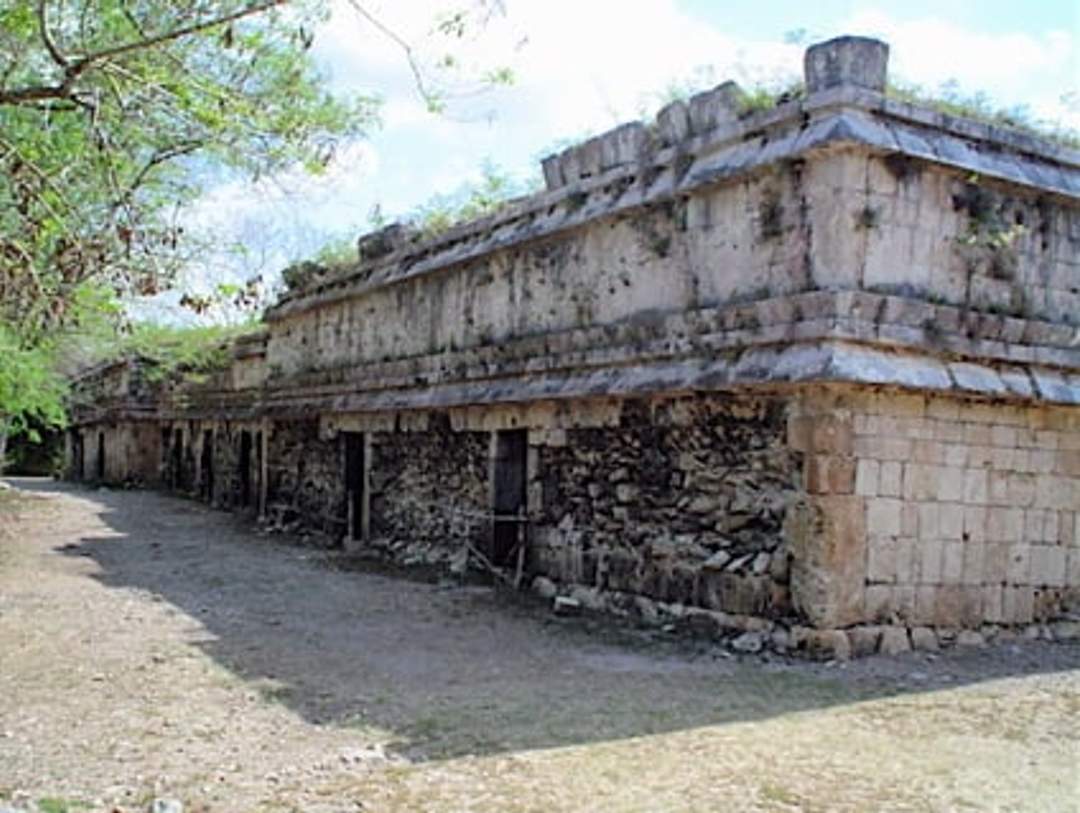 Akab Dzib at Chichen Itza, a long building with undeciphered hieroglyphs on inner doors, known for its 18 chambers and red hand paintings.