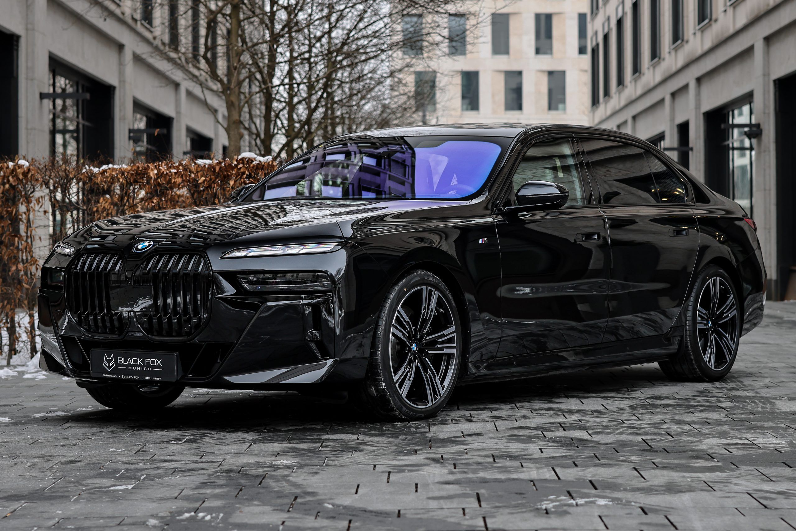 A picture of a BMW i7 on gray concrete