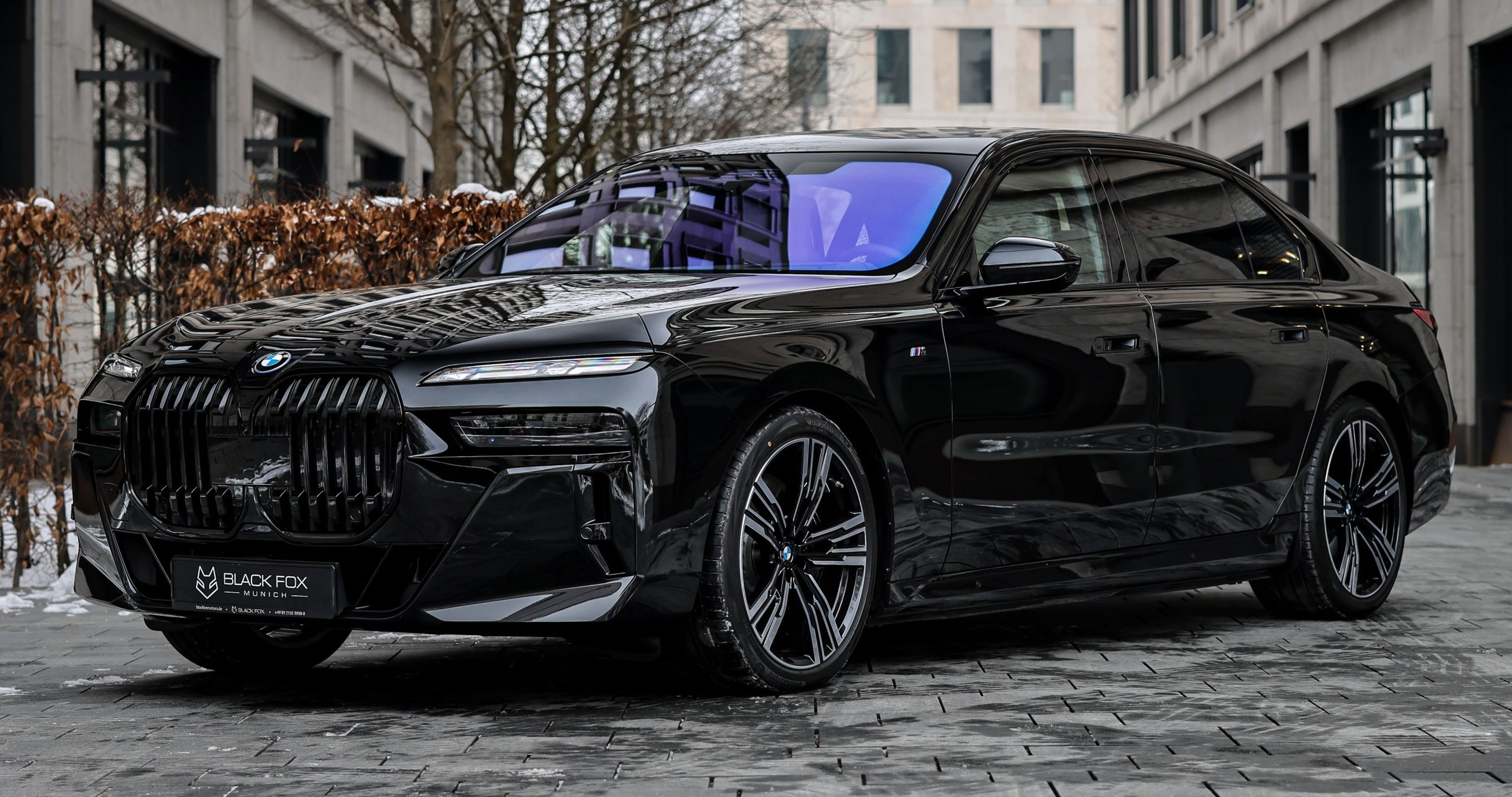 A picture of a BMW i7 on gray concrete