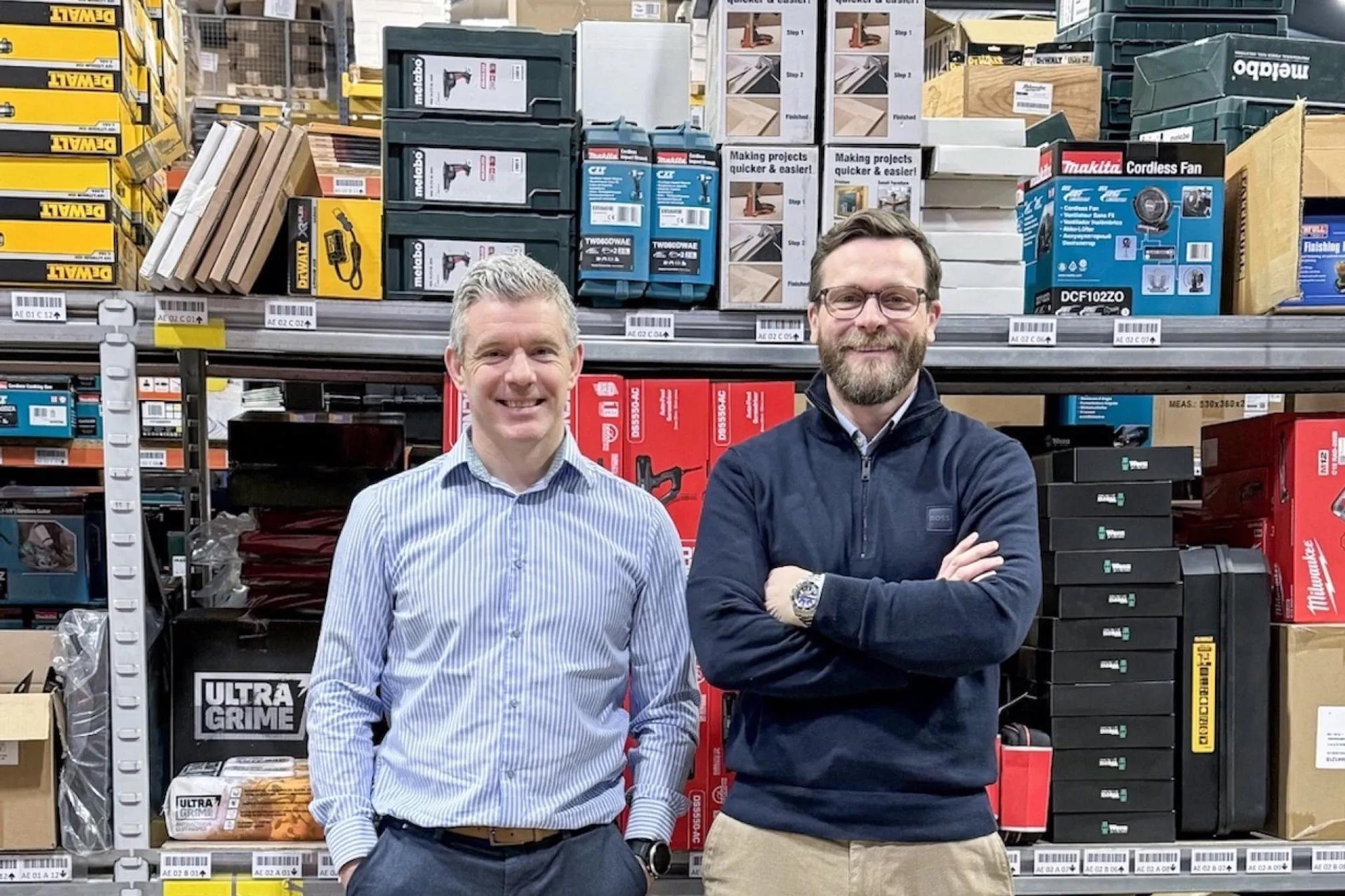The owners of Power Tool World in their warehouse