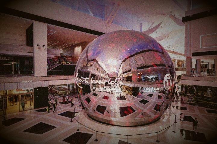 A massive reflective sphere displaying "Resorts World Las Vegas" in the center of a modern, multi-