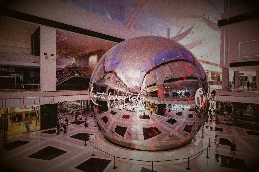 A massive reflective sphere displaying "Resorts World Las Vegas" in the center of a modern, multi-