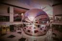A massive reflective sphere displaying "Resorts World Las Vegas" in the center of a modern, multi-