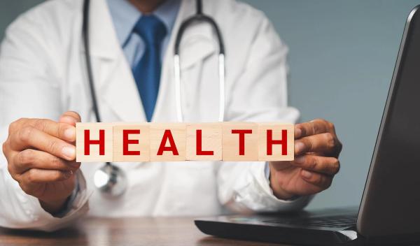 Doctor holding public health sign