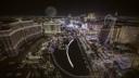 Nighttime aerial view of the Las Vegas Strip with illuminated resorts, the Bellagio fountains,
