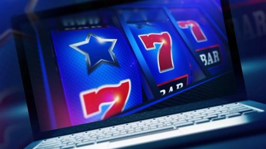 An online slot machine game with glowing blue reels and red number sevens displayed on a laptop screen.