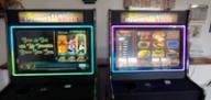 s go with: "Two Pennsylvania Skill electronic gaming machines side-by-side, displaying colorful slot-