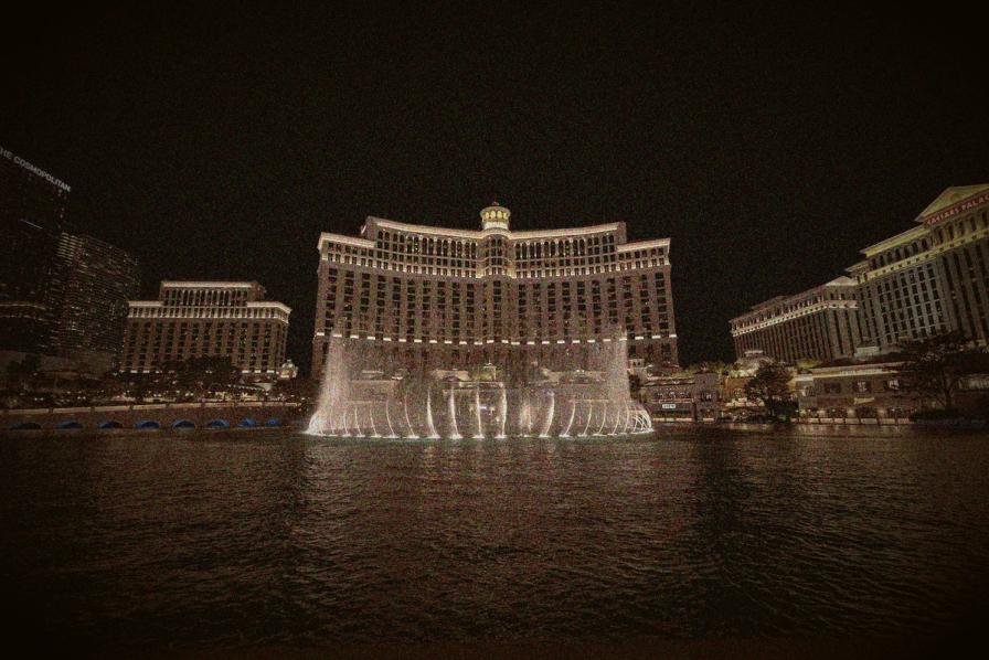 The illuminated Bellagio hotel and fountains in Las Vegas at night.