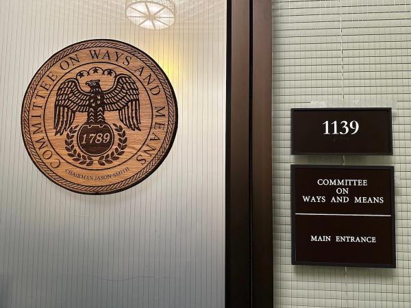 Entrance to the House Committee on Ways and Means office, room 1139, showing the committee seal on a glass door.