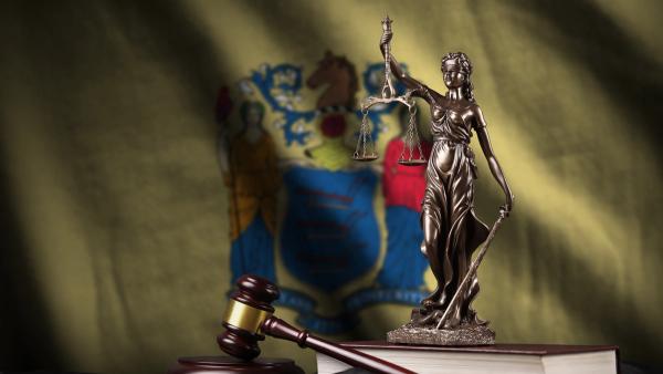 nj-flag-scales-justice-statue