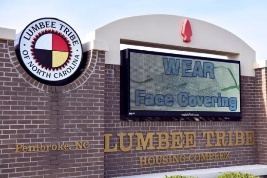 The Lumbee Tribe of North Carolina Housing Complex sign in Pembroke, NC, featuring the tribal