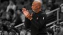 Portland Trail Blazers coach Chauncey Billups claps on the sideline during a basketball game.