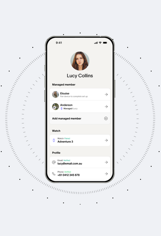 A smartphone displaying a profile screen for "Lucy Collins" with managed members and a paired watch, on a light grey background with a circular dotted pattern.