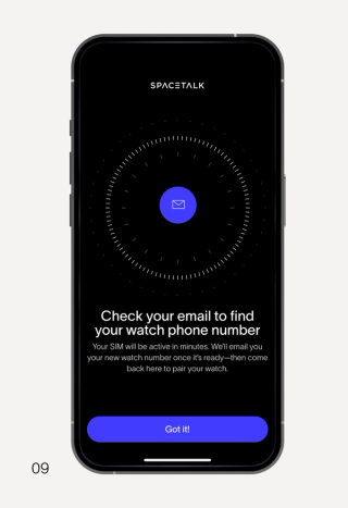 A smartphone displaying the Spacetalk app with instructions to check email for a watch phone number.